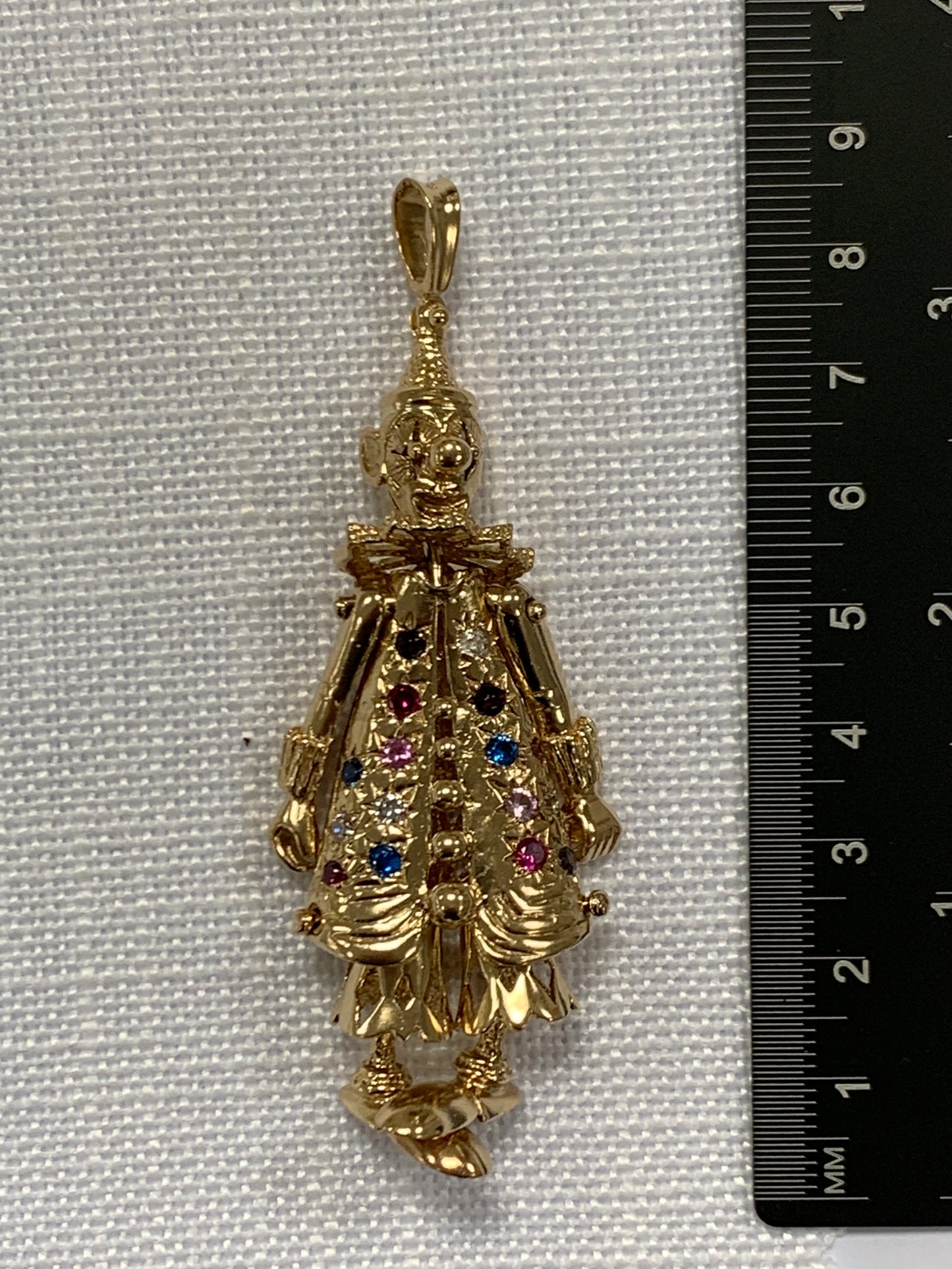 Fully articulated gold floppy clown pendant