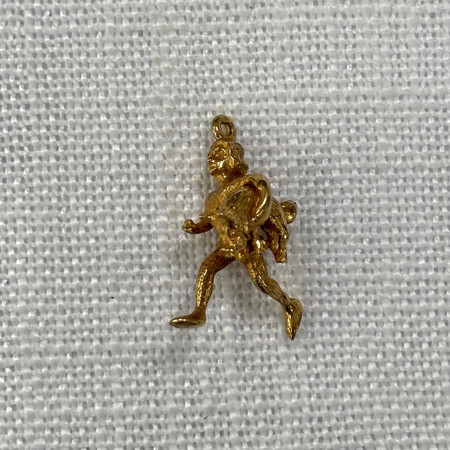 Man Carrying Pig Gold Charm