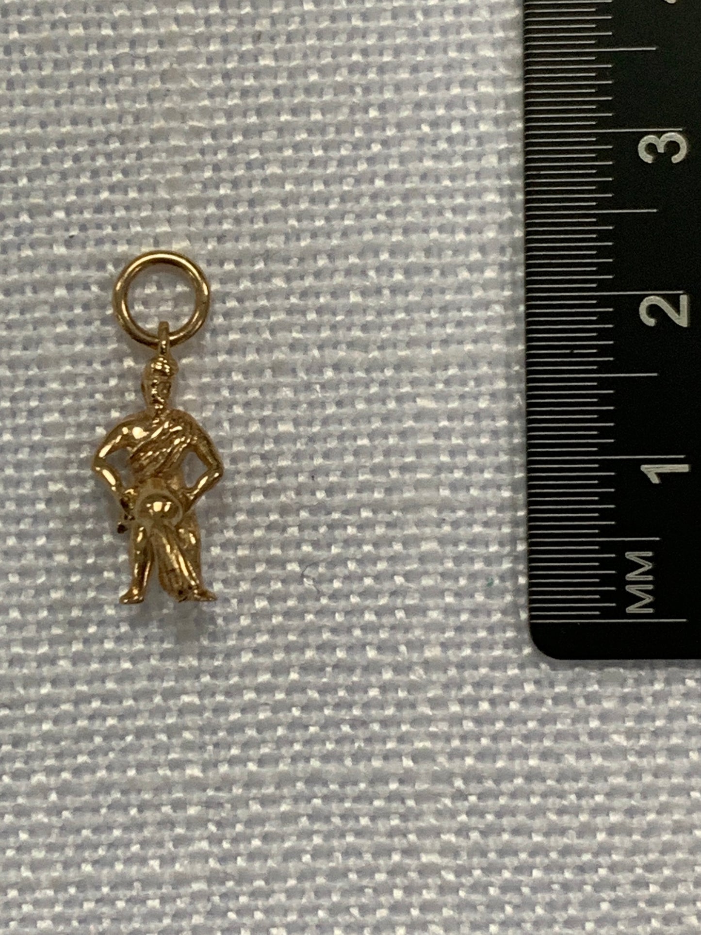 Man pouring water from bowl gold charm pendant