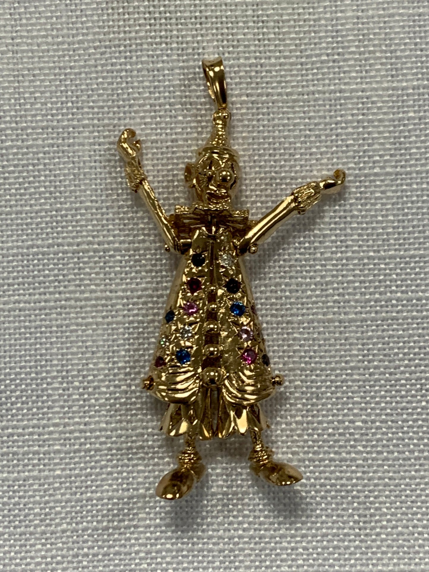 Fully articulated gold floppy clown pendant